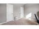 Neutral bedroom featuring two white doors, a light grey wall, and an air purifier appliance at 293 Carrick Glen Blvd, Pendleton, IN 46064