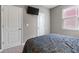 The bedroom features neutral walls, plush carpet, and two white doors at 293 Carrick Glen Blvd, Pendleton, IN 46064