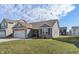 Beautiful single-story home with brick accents, attached garage, and a well-maintained front yard in a lovely neighborhood at 293 Carrick Glen Blvd, Pendleton, IN 46064