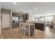 Spacious kitchen with an island, stainless steel appliances, and an open view to the inviting living area at 293 Carrick Glen Blvd, Pendleton, IN 46064