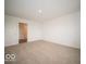 This bedroom features a large closet, tan carpet, and white walls at 3261 W Keepsake Ln, Monrovia, IN 46157
