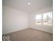 Well-lit bedroom with a large window and neutral carpet at 3261 W Keepsake Ln, Monrovia, IN 46157