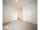 This carpeted bedroom features neutral paint and a closet at 3261 W Keepsake Ln, Monrovia, IN 46157