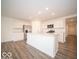 Bright open kitchen with stainless steel appliances, ample cabinetry, and large island at 3261 W Keepsake Ln, Monrovia, IN 46157