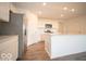 Modern kitchen boasts stainless appliances, an island, and plenty of cabinet space at 3261 W Keepsake Ln, Monrovia, IN 46157
