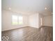 Spacious living area with hard surface floors and a view of the outdoors at 3261 W Keepsake Ln, Monrovia, IN 46157