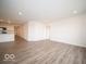 Spacious living space with hardwood floors is open to the kitchen and dining areas at 3261 W Keepsake Ln, Monrovia, IN 46157