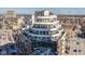 Aerial view showing building with layered balconies, and a mix of urban and residential landscape at 333 Massachusetts Ave # 801, Indianapolis, IN 46204