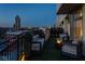 Relaxing condo balcony with outdoor seating and cityscape views, offering a cozy ambiance with a fire pit at 333 Massachusetts Ave # 801, Indianapolis, IN 46204