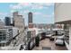 City skyline views from this relaxing balcony with a firepit and comfortable outdoor seating at 333 Massachusetts Ave # 801, Indianapolis, IN 46204