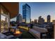 Relaxing outdoor balcony with a fire pit and comfortable seating area with views of the city at 333 Massachusetts Ave # 801, Indianapolis, IN 46204