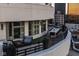 Spacious balcony with an outdoor dining table and comfortable seating area at 333 Massachusetts Ave # 801, Indianapolis, IN 46204
