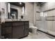 Modern bathroom featuring sleek vanity, framed mirror, and glass-enclosed walk-in shower with tile surround at 333 Massachusetts Ave # 801, Indianapolis, IN 46204