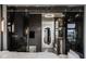 Contemporary bedroom featuring a glass wall leading to a modern bathroom and stunning city view at 333 Massachusetts Ave # 801, Indianapolis, IN 46204