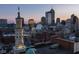 Urban cityscape view highlighting architectural landmarks, captured during the warm hues of sunset at 333 Massachusetts Ave # 801, Indianapolis, IN 46204