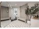 Welcoming entryway with stylish decor and a large mirror at 333 Massachusetts Ave # 801, Indianapolis, IN 46204