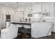 Kitchen features white cabinets, marble countertops, stainless steel appliances, and pendant lighting at 333 Massachusetts Ave # 801, Indianapolis, IN 46204
