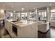 Modern kitchen with marble countertops, stainless steel appliances, island seating, and access to an outdoor balcony at 333 Massachusetts Ave # 801, Indianapolis, IN 46204