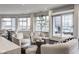 Bright living room featuring city views, neutral furniture, and a modern aesthetic at 333 Massachusetts Ave # 801, Indianapolis, IN 46204