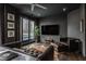 Stylish living room with leather seating, city view, and accent wall at 333 Massachusetts Ave # 801, Indianapolis, IN 46204