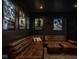 Home theater showcasing comfortable seating and movie posters on dark walls for immersive entertainment at 333 Massachusetts Ave # 801, Indianapolis, IN 46204