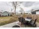 Fenced backyard featuring a spacious patio area with an outdoor dining table, perfect for gatherings at 342 E Minnesota St, Indianapolis, IN 46225