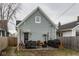 Charming backyard with patio, outdoor dining, grill, and lovely landscaping, perfect for entertaining at 342 E Minnesota St, Indianapolis, IN 46225