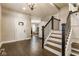 Inviting foyer boasts hardwood floors and elegant staircase at 342 E Minnesota St, Indianapolis, IN 46225