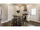 Charming kitchen with modern appliances, white cabinets, and a wooden center table with stools at 342 E Minnesota St, Indianapolis, IN 46225