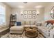 Comfortable living room with a large sectional sofa, patterned rug, and stylish decor at 342 E Minnesota St, Indianapolis, IN 46225