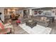 Spacious basement features a large sectional sofa, ping pong table and kitchenette at 3982 Abbotsford Dr, Westfield, IN 46074