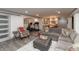 Open-concept basement with a living area, kitchenette, and exercise equipment at 3982 Abbotsford Dr, Westfield, IN 46074