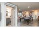 Modern half-bathroom with gray vanity, mosaic tile floors, and decorative wall accents at 3982 Abbotsford Dr, Westfield, IN 46074