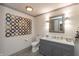 Elegant bathroom with marble countertop, modern fixtures, and decorative wall art at 3982 Abbotsford Dr, Westfield, IN 46074