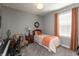 Comfortable bedroom featuring a twin bed, gray walls, and a window with light-blocking curtains at 3982 Abbotsford Dr, Westfield, IN 46074