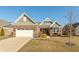 Charming brick home featuring attached garage, manicured landscaping, and inviting curb appeal at 3982 Abbotsford Dr, Westfield, IN 46074