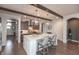 Open-concept kitchen with a large island, stainless steel appliances, and wood flooring at 3982 Abbotsford Dr, Westfield, IN 46074