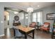 Stylish home office showcasing wood floors, desk, comfortable seating, and elegant lighting fixtures at 3982 Abbotsford Dr, Westfield, IN 46074