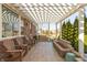 Covered patio with wooden seating, fireplace feature, and view of the backyard, ideal for outdoor enjoyment at 3982 Abbotsford Dr, Westfield, IN 46074