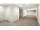 A finished basement offers lots of open area and neutral carpet at 5937 Broadway St, Indianapolis, IN 46220