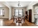 Dining room with hardwood floors, natural light, and archway to the kitchen at 5937 Broadway St, Indianapolis, IN 46220