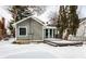 Exterior shot of a house with a snow-covered deck and enclosed sunroom at 5937 Broadway St, Indianapolis, IN 46220