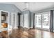 Bedroom with hardwood floors, vaulted ceiling, natural light, en-suite bathroom and private balcony at 5937 Broadway St, Indianapolis, IN 46220