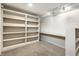 A home office space in the basement with built in shelving units at 5937 Broadway St, Indianapolis, IN 46220