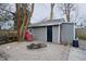 Backyard features a shed, fire pit, and gravel ground cover perfect for outdoor enjoyment at 6047 Guilford Ave, Indianapolis, IN 46220