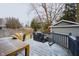 Backyard deck with outdoor dining table, grill and patio furniture at 6047 Guilford Ave, Indianapolis, IN 46220