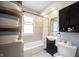 Bathroom with toilet, vanity, bathtub and shower at 6047 Guilford Ave, Indianapolis, IN 46220