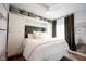 Comfortable bedroom with built-in storage, accent wall and lots of bright, natural light at 6047 Guilford Ave, Indianapolis, IN 46220