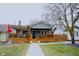 Charming home with a covered front porch, wooden railings, and decorative touches at 6047 Guilford Ave, Indianapolis, IN 46220
