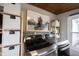 A view of a bright laundry room, featuring a side by side washer and dryer and custom storage at 6047 Guilford Ave, Indianapolis, IN 46220